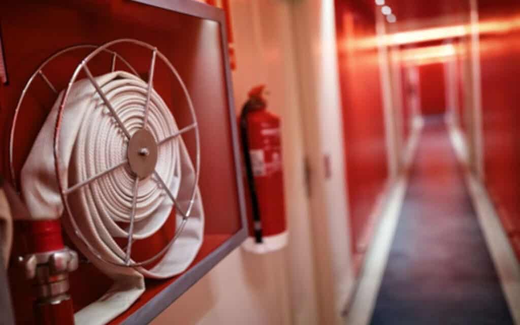 Image of corridor showing fire hose and extinguisher
