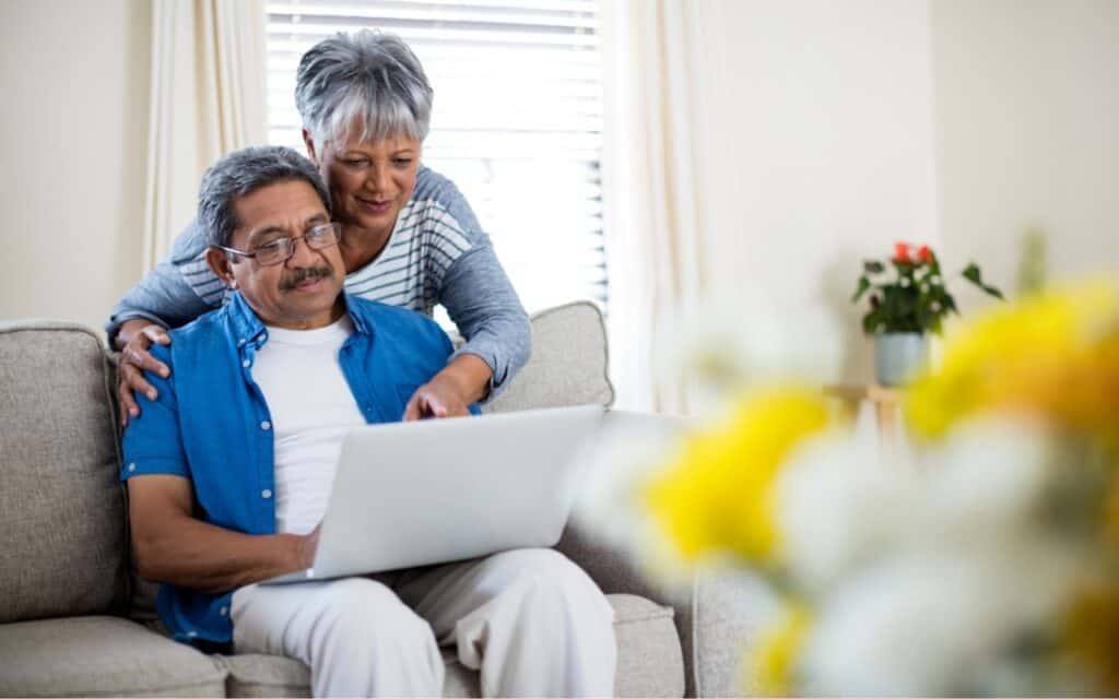 Two People Viewing A Laptop 1024x640