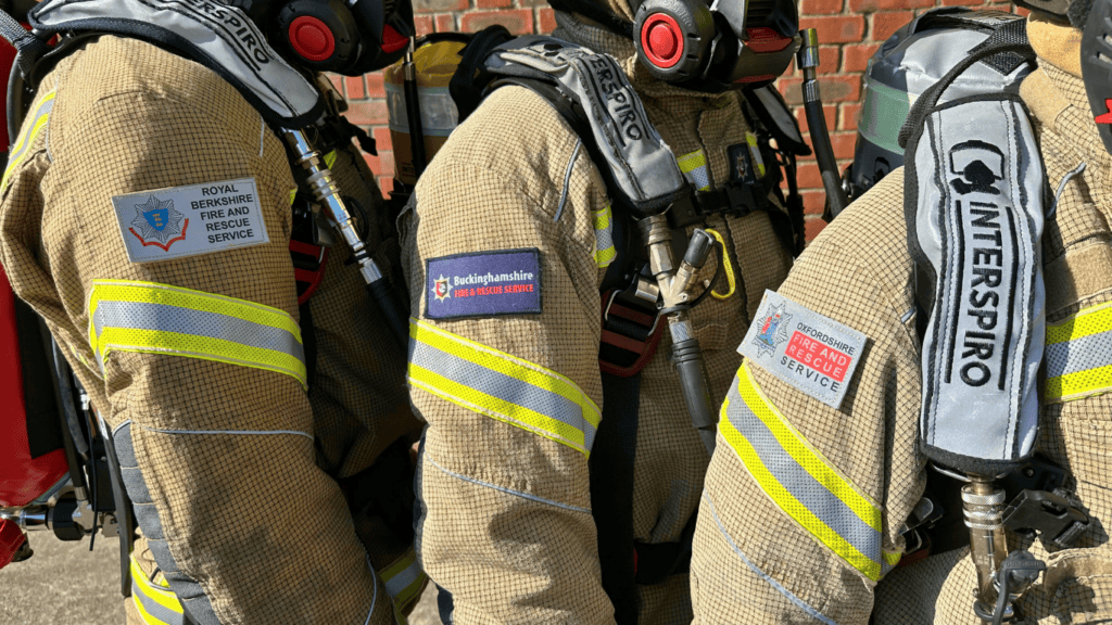 Photo showing three services badges on fire kit